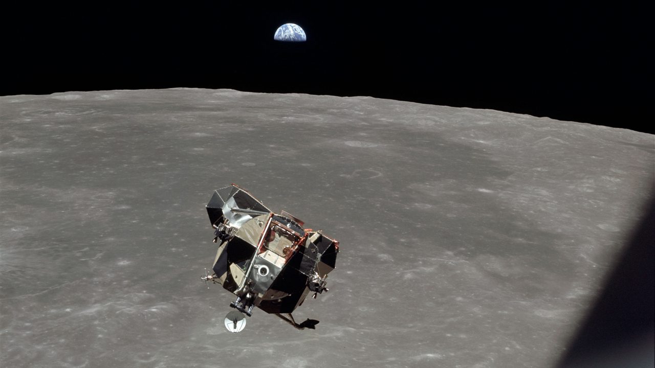 Eagle above the Moon with the Earth rising, photographed from Columbia (NASA AS11-44-6642)